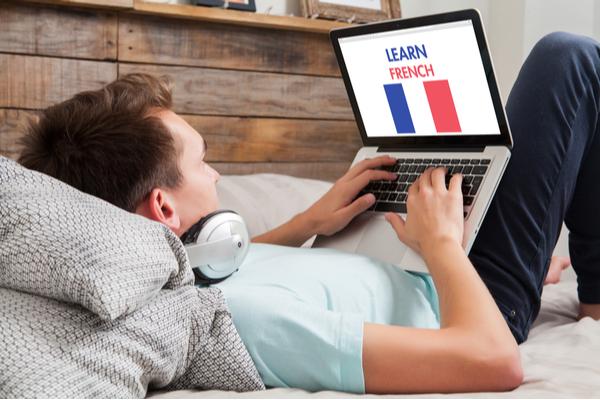 man-in-laptop-learning-french-online